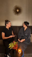 Skincare therapist and client have a consultation together